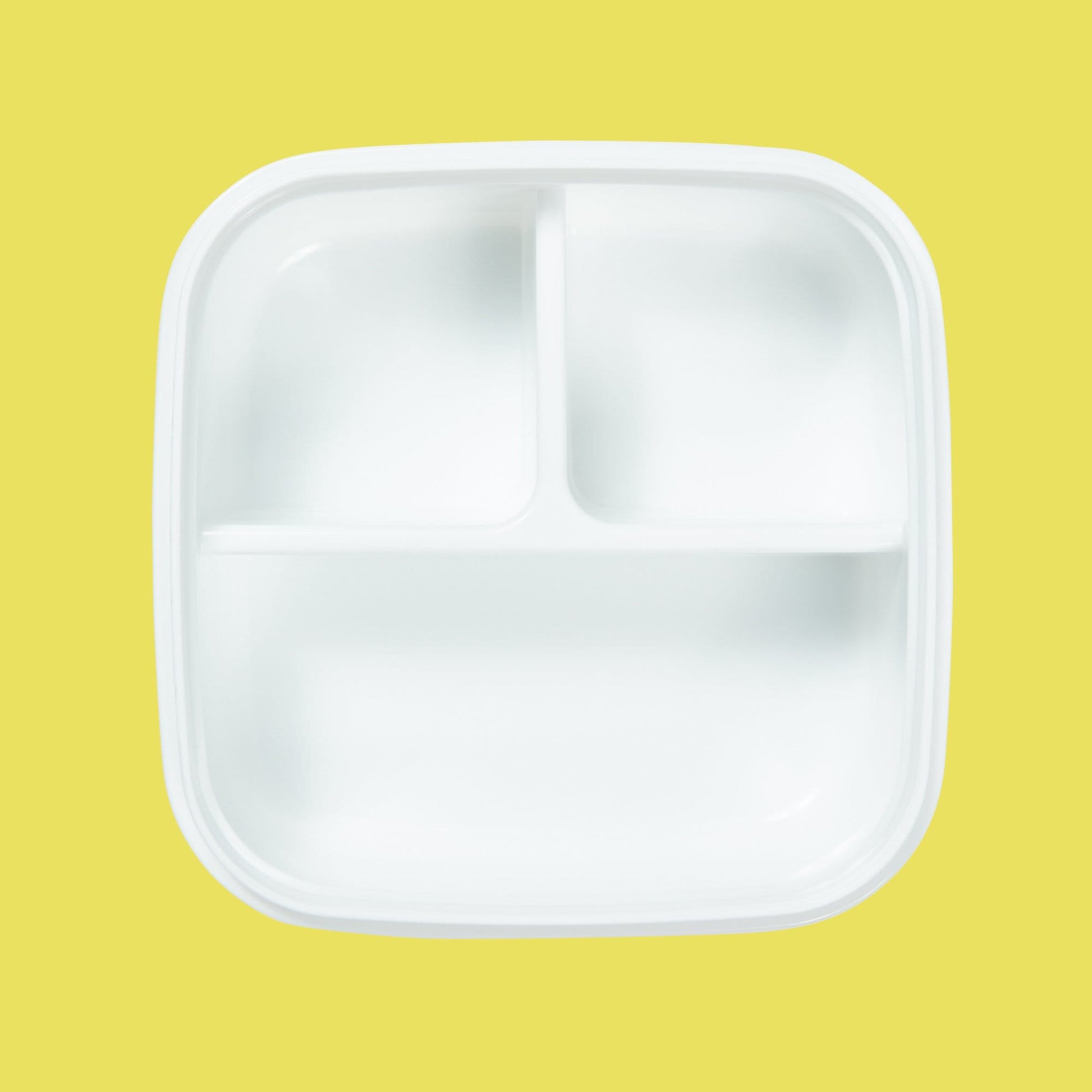 inside of white bento box showing dividers in three sections